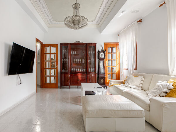 Living room with TV and classic cabinet — De Villa Suites