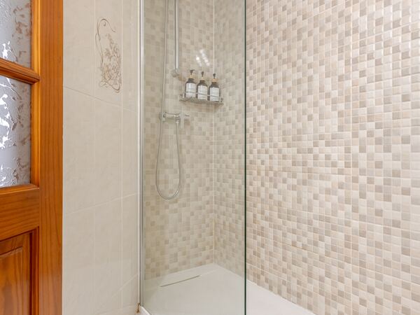 Shower with hydraulic mosaic tiles — De Villa Suites